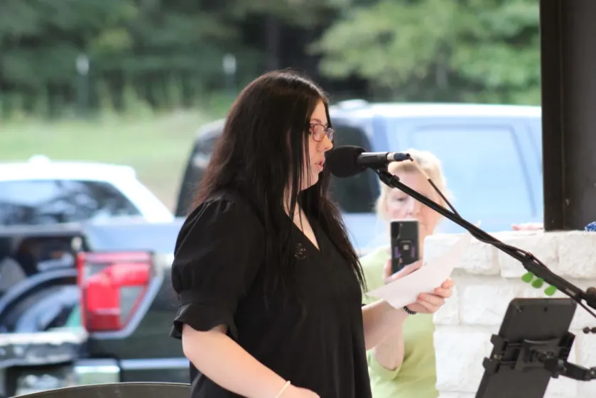 A young Republican speaking at an outdoor Grassroots event.